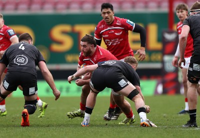240126 - Scarlets v Ulster - United Rugby Championship - Kemsley Mathias of Scarlets is tackled by Charlie Irvine of Ulster 