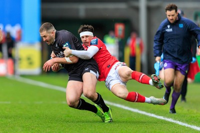 240126 - Scarlets v Ulster - United Rugby Championship - Stuart McCloskey of Ulster is tackled by Tom Rogers of Scarlets