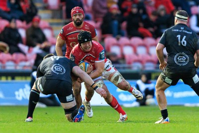 240126 - Scarlets v Ulster - United Rugby Championship - Jac Price of Scarlets is tackled by Harry Sheridan of Ulster