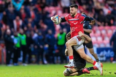 240126 - Scarlets v Ulster - United Rugby Championship - Johnny Williams of Scarlets is tackled by Dave McCann of Ulster just short of the try line