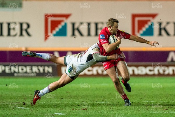 240218 - Scarlets v Ulster, Guinness PRO14 -  Paul Asquith of Scarlets is tackled by Luke Marshall of Ulster 