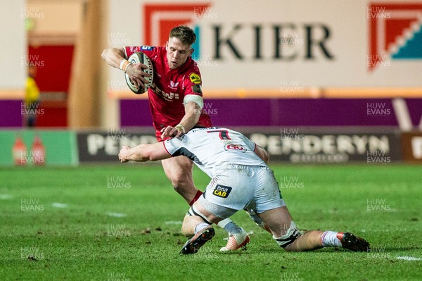 240218 - Scarlets v Ulster, Guinness PRO14 -  Tom Williams of Scarlets trues to get past Nick Timoney of Ulster  