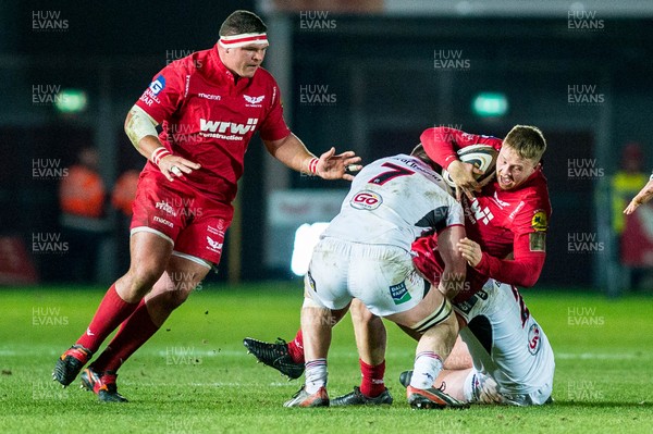 240218 - Scarlets v Ulster, Guinness PRO14 - Nick Timoney of Ulster  tackles James Davies of Scarlets 
