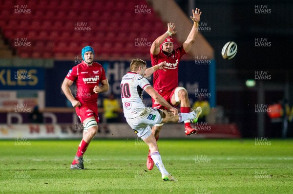 240218 - Scarlets v Ulster, Guinness PRO14 - Josh Macleod of Scarlets  tries to block a kick by Johnny McPhillips of Ulster  