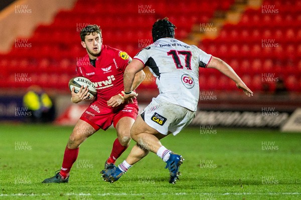 240218 - Scarlets v Ulster, Guinness PRO14 - Dan Jones  of Scarlets tries to take the ball past Kyle McCall of Ulster 