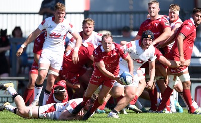 240819 - Scarlets A v Ulster A - Celtic Cup - Efan Jones of Scarlets A is tackled by Azur Allison