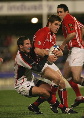 27.10.06...Llanelli Scarlets v Ulster, Heineken Cup Rugby Scarlets' Gavin Evans is held by Paddy Wallace 