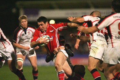 27.10.06...Llanelli Scarlets v Ulster, Heineken Cup Rugby Scarlets' Stephen Jones takes on the Ulster defence 