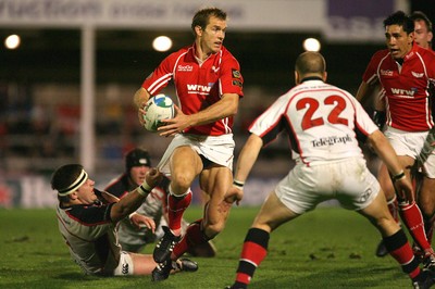 27.10.06...Llanelli Scarlets v Ulster, Heineken Cup Rugby Scarlets Dafydd James breaks Bryan Youngs tackle 