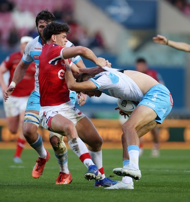 250426 - Scarlets v Vodacom Bulls - United Rugby Championship - David Kriel of Bulls has his jersey ripped off by Eddie James of Scarlets 