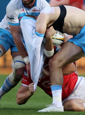 250426 - Scarlets v Vodacom Bulls - United Rugby Championship - David Kriel of Bulls has his jersey ripped off by Eddie James of Scarlets 