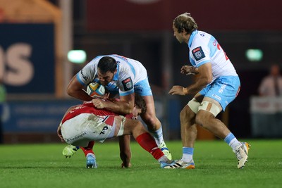 250426 - Scarlets v Vodacom Bulls - United Rugby Championship - Francois Kloppers of Bulls is tackled by Taine Plumtree of Scarlets 