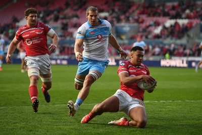 250426 - Scarlets v Vodacom Bulls - United Rugby Championship - Callum Woolley of Scarlets stops Cameron Hanekom of Bulls from getting to the ball
