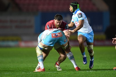 250426 - Scarlets v Vodacom Bulls - United Rugby Championship - Kemsley Mathias of Scarlets is challenged by Johan Grobbelaar of Bulls