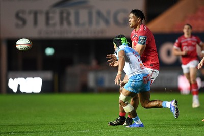 250426 - Scarlets v Vodacom Bulls - United Rugby Championship - Sam Lousi of Scarlets is challenged by Kurt-Lee Arendse of Bulls