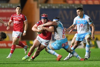 250426 - Scarlets v Vodacom Bulls - United Rugby Championship - Josh Morse of Scarlets is challenged by Marcell Coetzee of Bulls