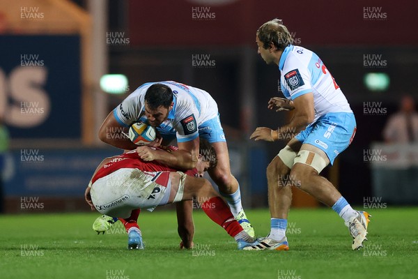 250426 - Scarlets v Vodacom Bulls - United Rugby Championship - Francois Kloppers of Bulls is tackled by Taine Plumtree of Scarlets 