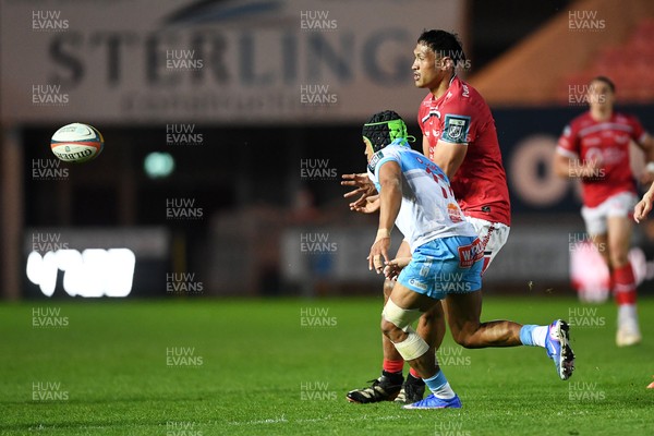 250426 - Scarlets v Vodacom Bulls - United Rugby Championship - Sam Lousi of Scarlets is challenged by Kurt-Lee Arendse of Bulls