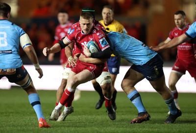 270123 - Scarlets v Vodacom Bulls - United Rugby Championship - Johnny McNicholl of Scarlets is tackled by Marco van Staden of Bulls