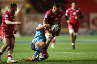 270123 - Scarlets v Vodacom Bulls - United Rugby Championship - Dan Davis of Scarlets is tackled by Johan Grobbelaar of Bulls