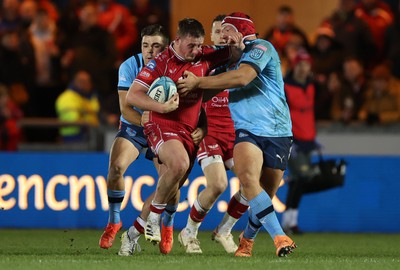 270123 - Scarlets v Vodacom Bulls - United Rugby Championship - Daf Hughes of Scarlets is tackled by Johan Grobbelaar of Bulls