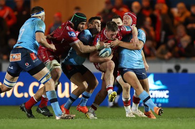 270123 - Scarlets v Vodacom Bulls - United Rugby Championship - Daf Hughes of Scarlets is tackled by Johan Grobbelaar of Bulls