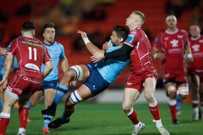 270123 - Scarlets v Vodacom Bulls - United Rugby Championship - Ruan Vermaak of Blue Bulls is tackled by Johnny McNicholl of Scarlets