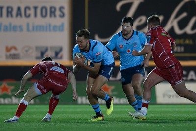 270123 - Scarlets v Vodacom Bulls - United Rugby Championship - David Kriel of Blue Bulls is tackled by Ryan Conbeer of Scarlets