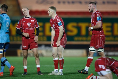 270123 - Scarlets v Vodacom Bulls - United Rugby Championship - Scarlets players Ioan Nicholas, Johnny McNicholl and Morgan Jones show relief at the final whistle