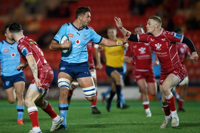 270123 - Scarlets v Vodacom Bulls - United Rugby Championship - Ruan Vermaak of Vodacom Bulls fends Johnny McNicholl of Scarlets