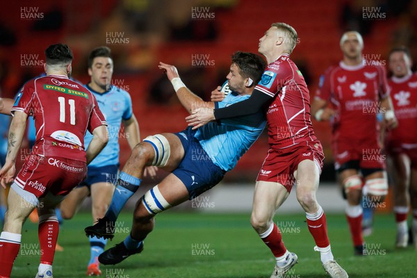 270123 - Scarlets v Vodacom Bulls - United Rugby Championship - Ruan Vermaak of Blue Bulls is tackled by Johnny McNicholl of Scarlets