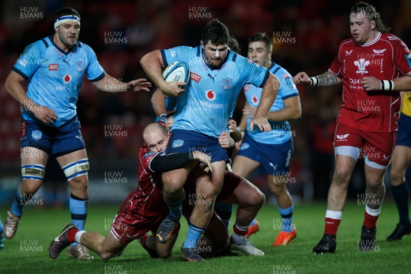 270123 - Scarlets v Vodacom Bulls - United Rugby Championship - Marco van Staden of Blue Bulls is tackled by Ioan Nicholas of Scarlets