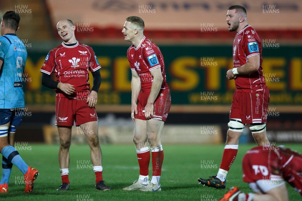 270123 - Scarlets v Vodacom Bulls - United Rugby Championship - Scarlets players Ioan Nicholas, Johnny McNicholl and Morgan Jones show relief at the final whistle