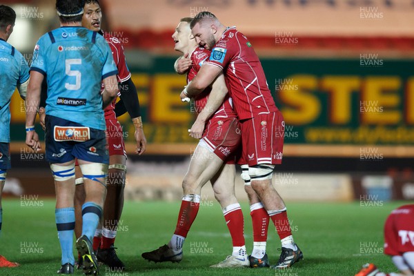 270123 - Scarlets v Vodacom Bulls - United Rugby Championship - Johnny McNicholl and Morgan Jones of Scarlets embrace the end of the match