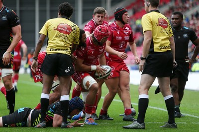 121019 - Scarlets v Zebre Rugby - Guinness PRO14 - Josh Macleod of Scarlets celebrates scoring a try with team mates