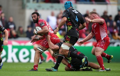 121019 - Scarlets v Zebre Rugby - Guinness PRO14 - Uzair Cassiem of Scarlets is tackled by Daniele Rimpelli of Zebre