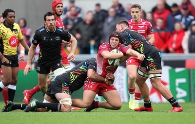 121019 - Scarlets v Zebre Rugby - Guinness PRO14 - Taylor Davies of Scarlets is tackled by Mick Kearney of Zebre