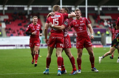 121019 - Scarlets v Zebre Rugby - Guinness PRO14 - Johnny McNicholl of Scarlets celebrates scoring a try with team mates