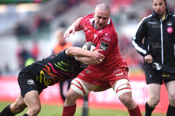 130419 - Scarlets v Zebre - Guinness PRO14 - Will Boyde of Scarlets is tackled by Gabriele Di Giulio of Zebre