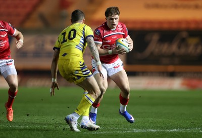 200326 - Scarlets v Zebre Parma - United Rugby Championship - Macs Page of Scarlets is tackled by Giacomo Da Re of Zebre 
