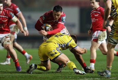 200326 - Scarlets v Zebre Parma - United Rugby Championship - Sam Lousi of Scarlets is tackled by Giampietro Ribaldi of Zebre 