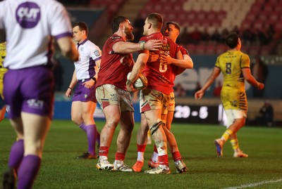 200326 - Scarlets v Zebre Parma - United Rugby Championship - Jarrod Taylor of Scarlets celebrates scoring a try with team mates