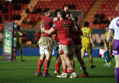 200326 - Scarlets v Zebre Parma - United Rugby Championship - Jarrod Taylor of Scarlets celebrates scoring a try with team mates