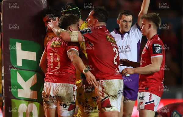 200326 - Scarlets v Zebre Parma - United Rugby Championship - Macs Page of Scarlets celebrates scoring a try with team mates