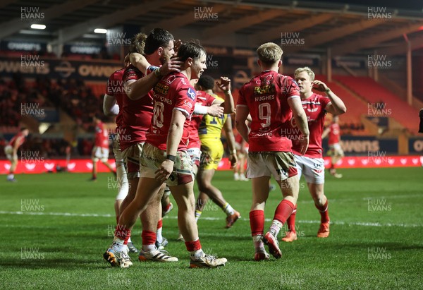 200326 - Scarlets v Zebre Parma - United Rugby Championship - Ellis Mee of Scarlets celebrates scoring a try with team mates