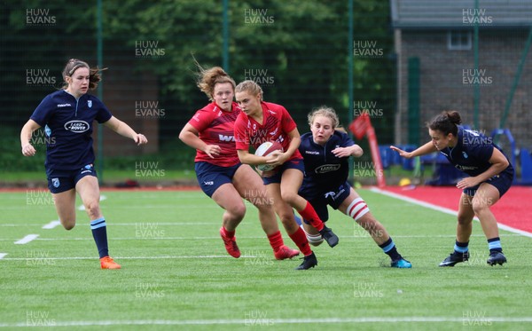 230918 - Scarlets Women v Cardiff Blues Women - Katie Thicker of Scarlets is tackled