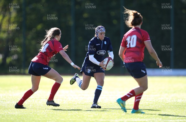 230918 - Scarlets Women v Cardiff Blues Women - Raf Taylor of Blues takes on Caitlin Lewis of Scarlets and Jodie Evans of Scarlets