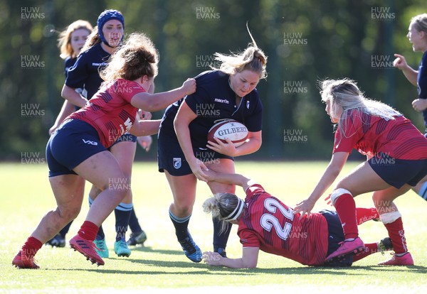 230918 - Scarlets Women v Cardiff Blues Women - Lilly Snape of Blues takes on the Scarlets line
