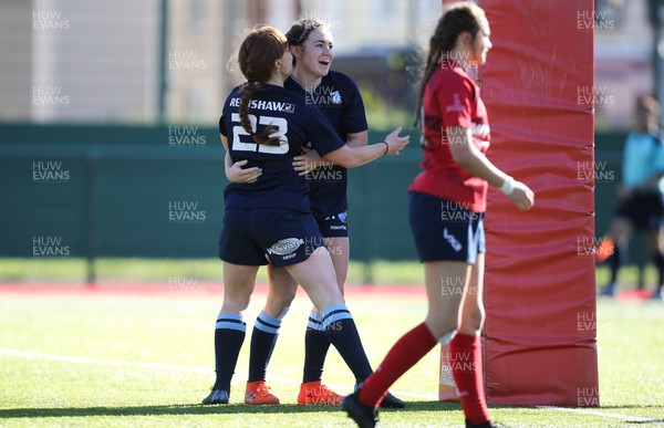 230918 - Scarlets Women v Cardiff Blues Women - Angharad De Smet of Blues celebrates with Seren Gough Walter after she races in to score try
