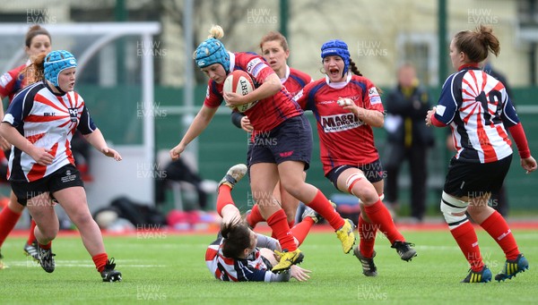 060316 - Scarlets Women v Ospreys Women -Delete Davies of Scarlets beats tackle by Angharad Jones